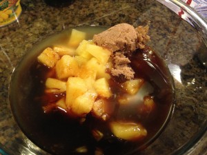 Pineapple chunks with juice, brown sugar, and soy sauce, before mixing